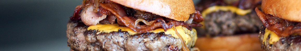 Eating Burger at J J Grill restaurant in Ontario, CA.
